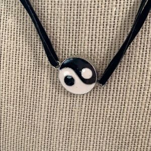 Yin and Yang pendant on leather